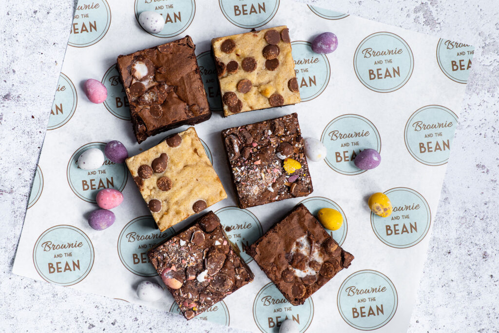 A selection of specially crafted brownies displayed on a branded piece of paper