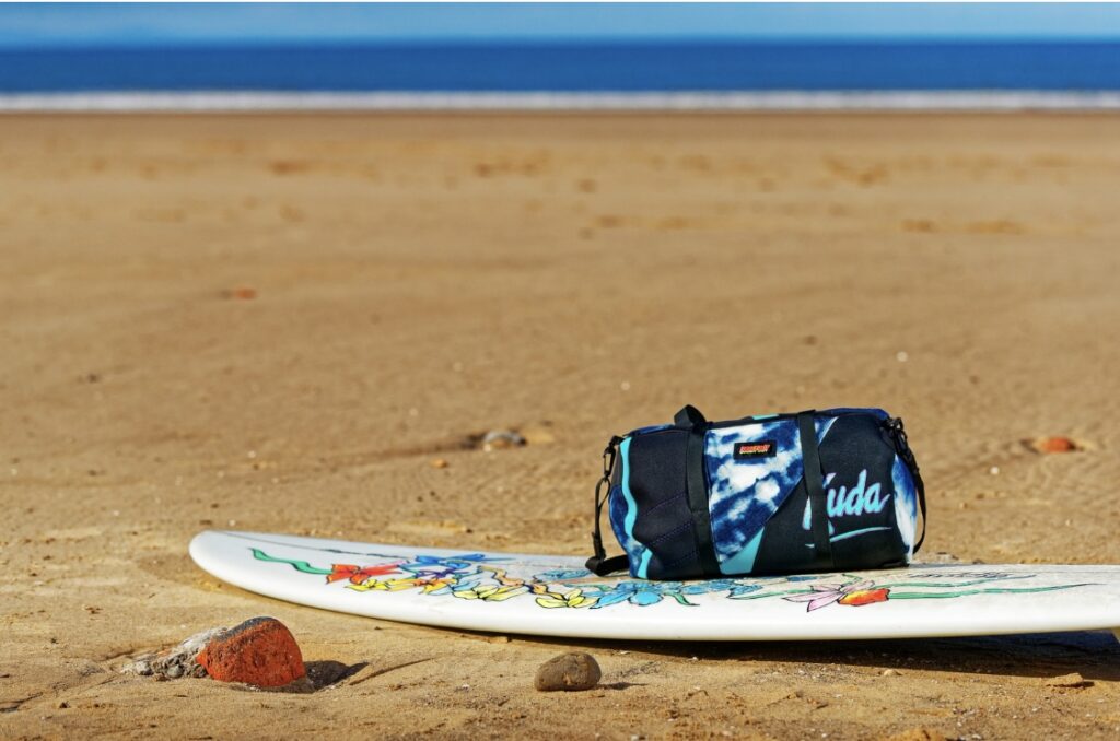 Barefoot product on top of a surfboard. 